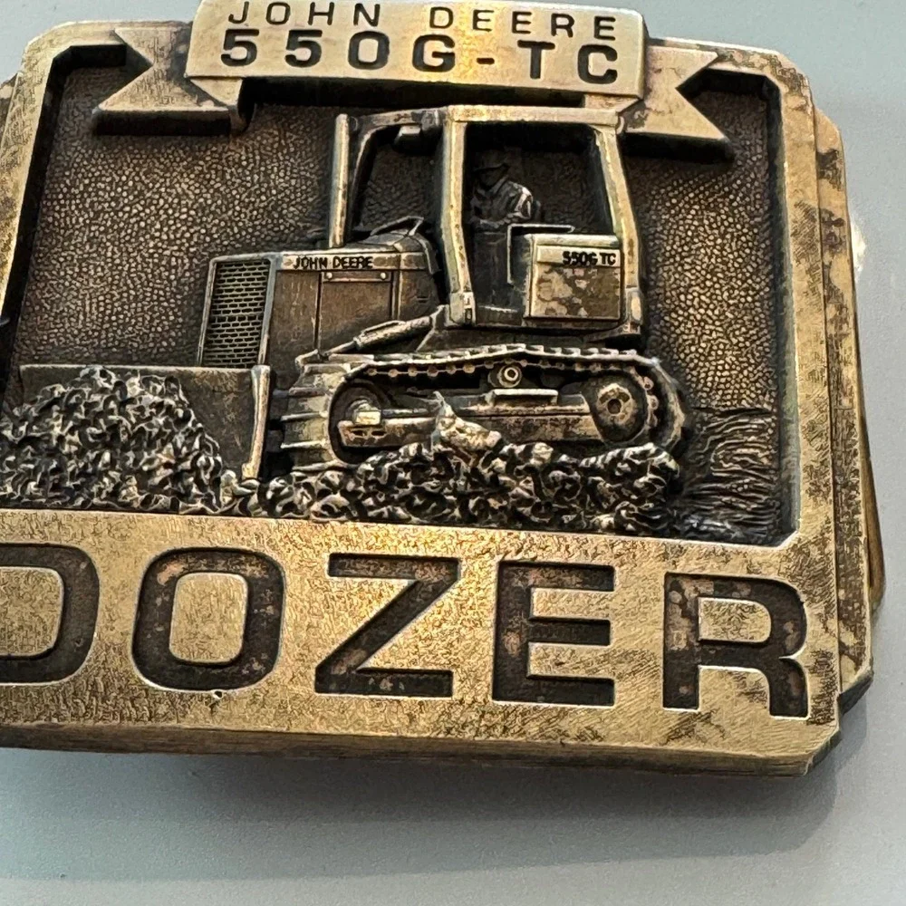 John Deere vintage brass